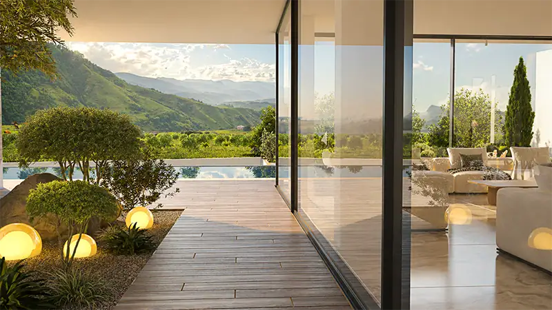 Rendu 3D d'une villa moderne, baies vitrées et terrasse bois avec vue sur les montagnes verdoyantes du Sud de la France.